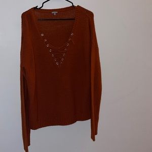Rust criss cross v neck sweater